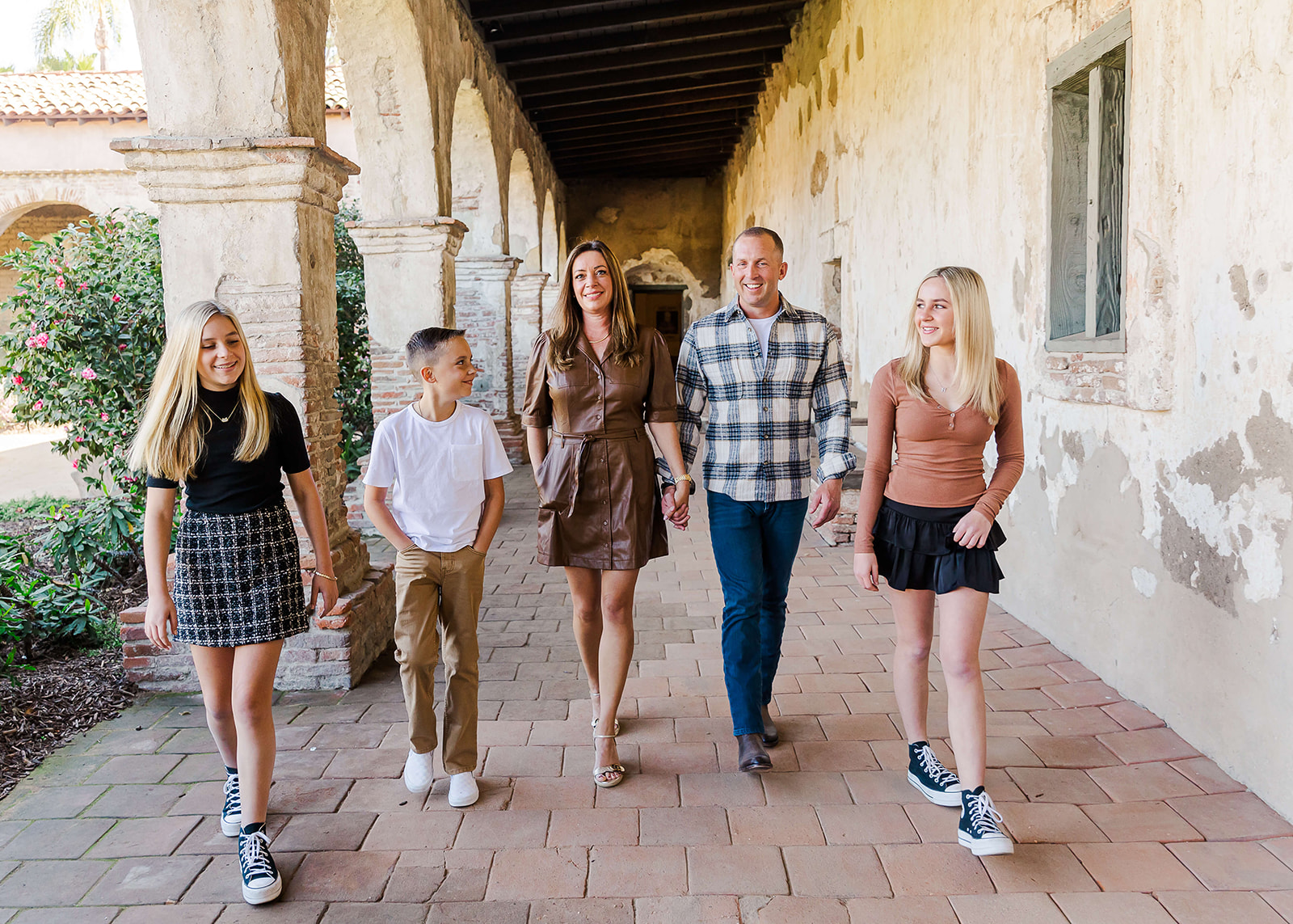 family of 5 walking and laughing together Things To Do In Orange County With Kids