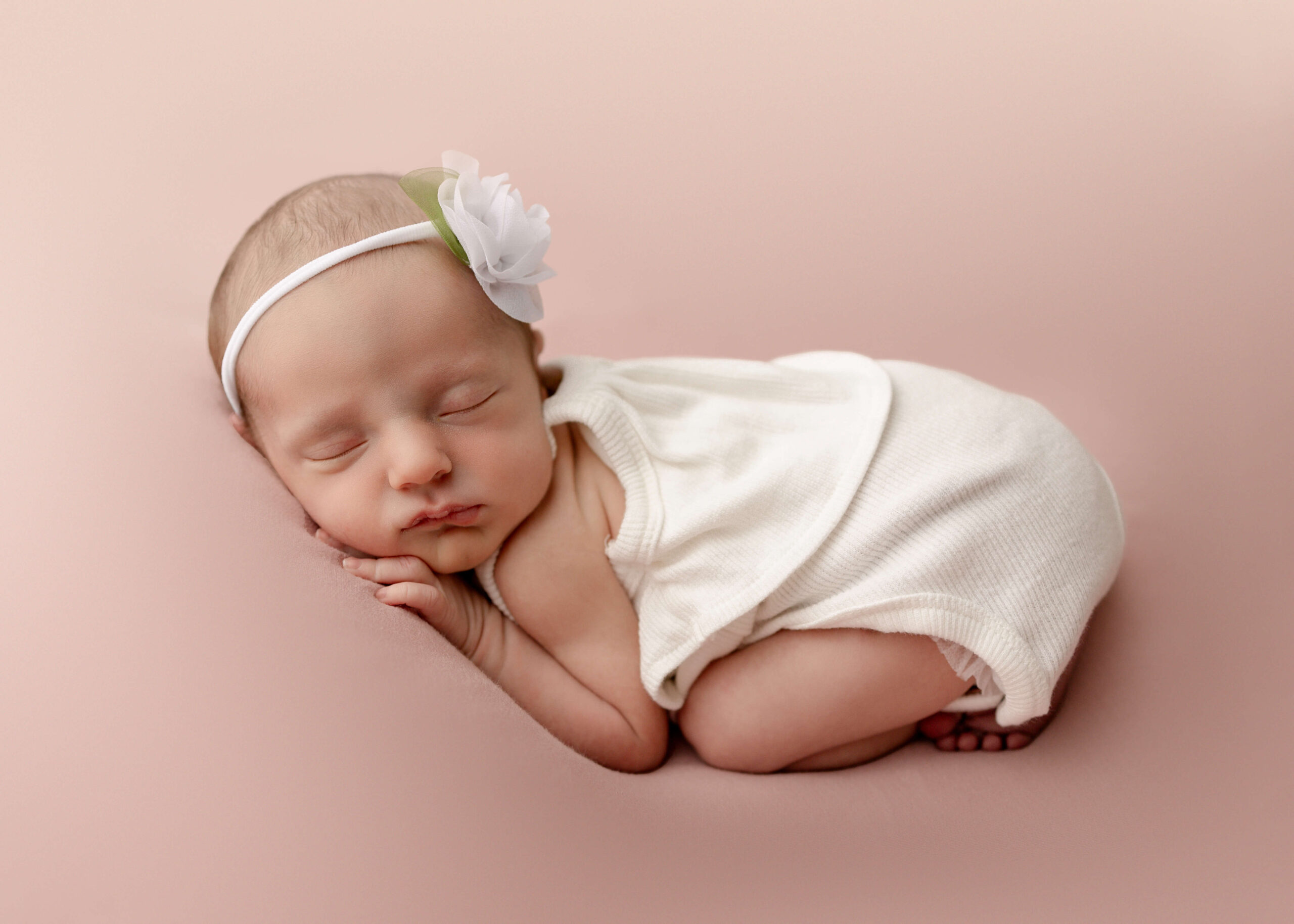 Baby sleeping in studio session by Ashley Nicole.