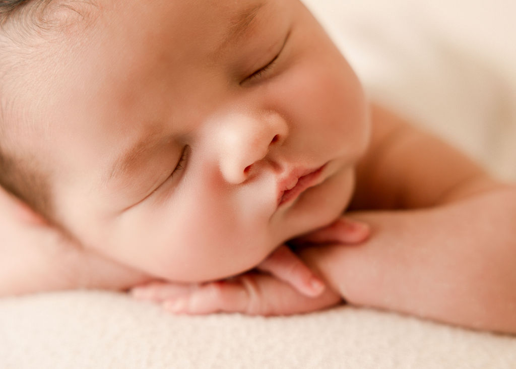 Details of a sleeping newborn baby's face after meeting with long beach pediatricians